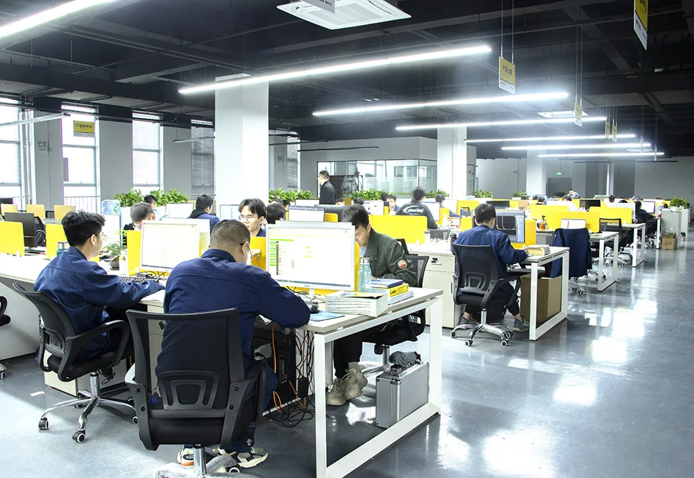 Open-plan office with desks and team members at work
