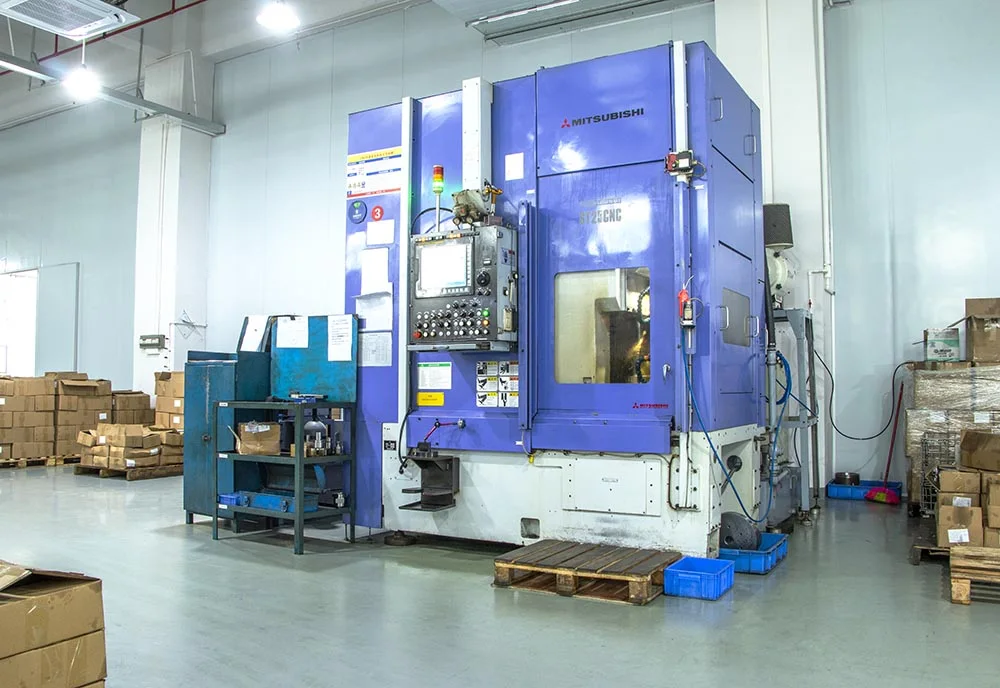 Large enclosed machine tool on the workshop floor